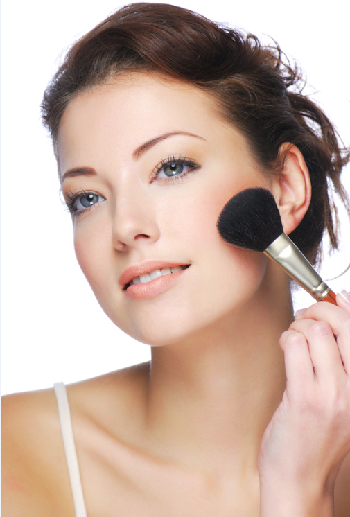 woman-applying-mineral-makeup-blush-face.png