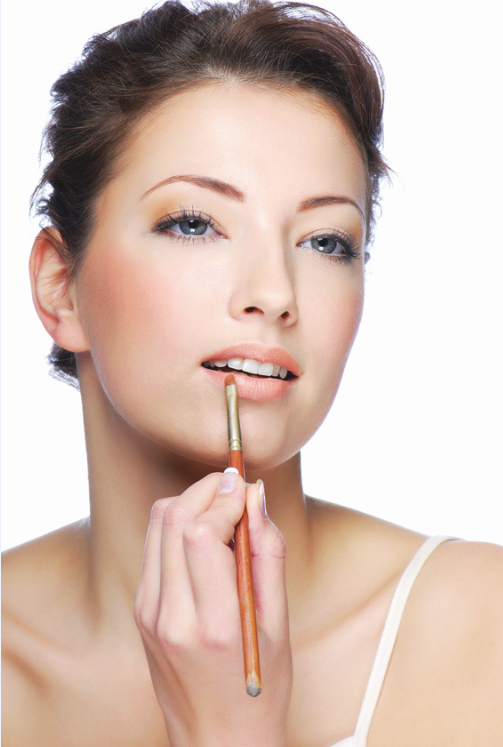 woman-applying-mineral-makeup-lip-color.png